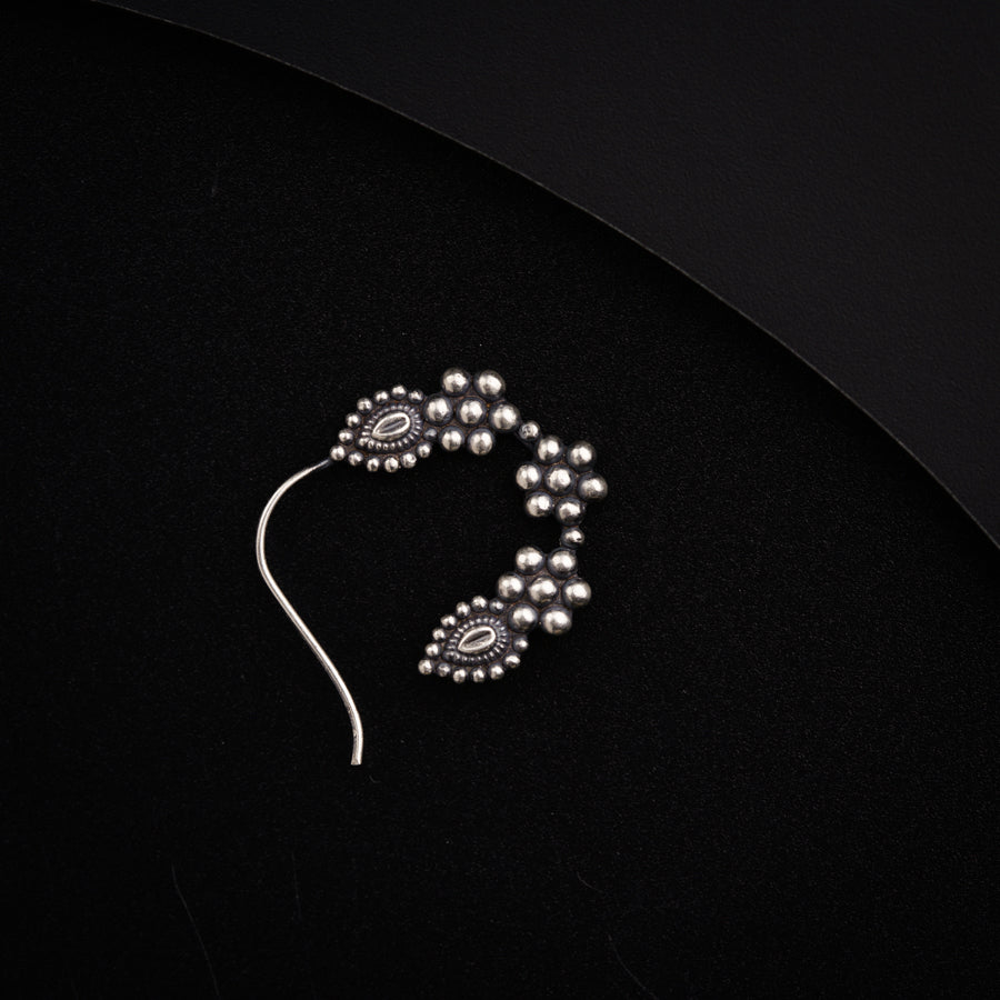 a close up of a beaded necklace on a black surface