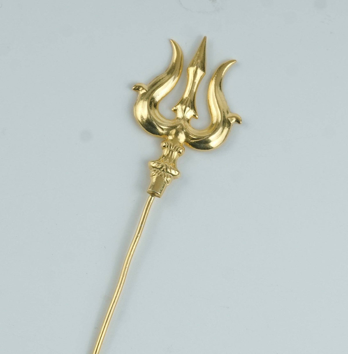 Angled view of Trishul highlighting its distinctive three-pronged design, detailed structure, and premium 22K Gold-Plated finish