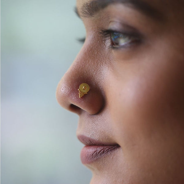 a close up of a person with a nose piercing