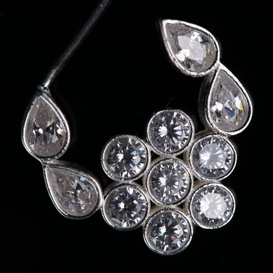 a close up of a diamond brooch