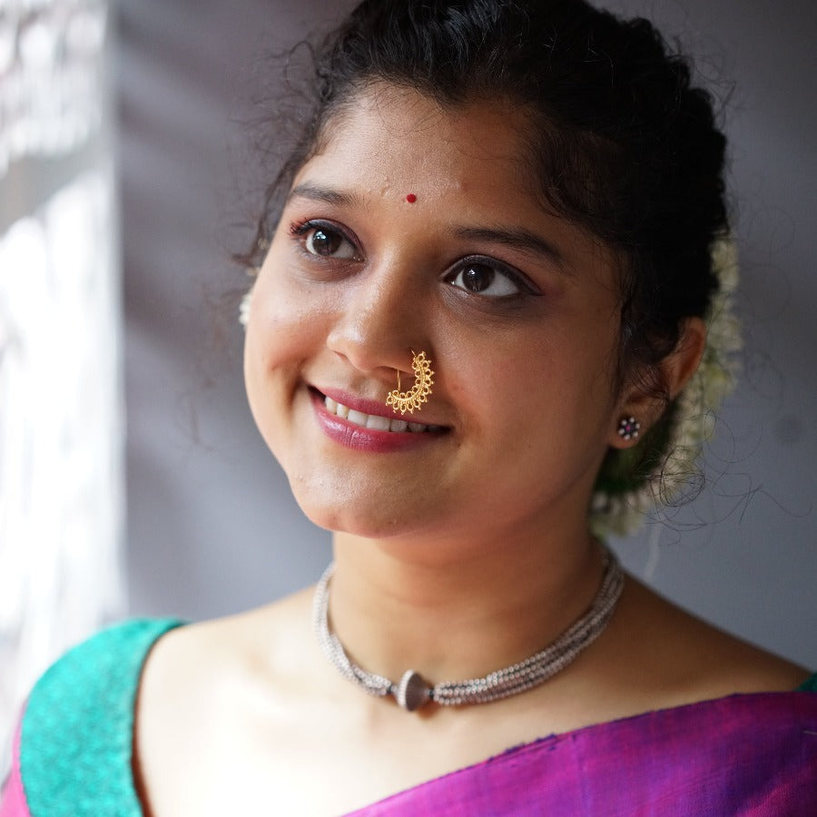 a woman with a nose piercing on her nose