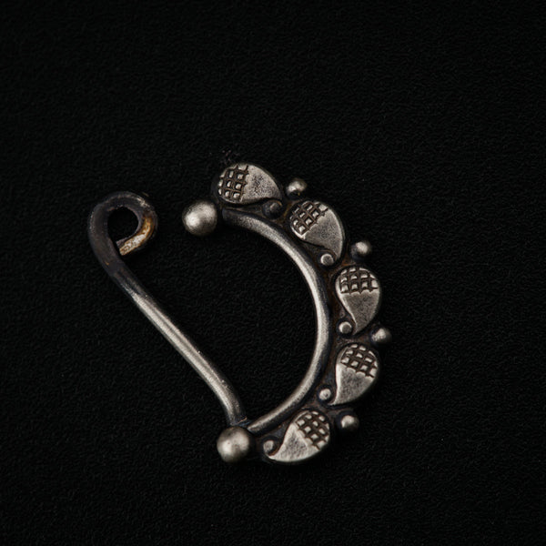 a metal hook with a design on it