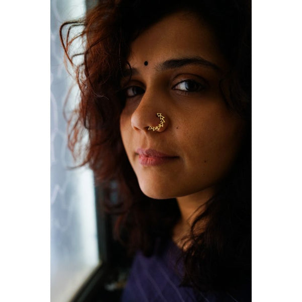 a close up of a person with a nose piercing