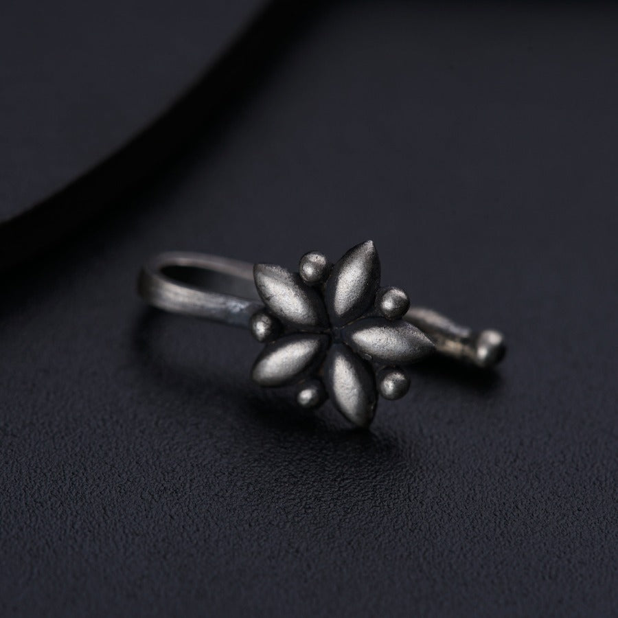 a close up of a ring on a black surface