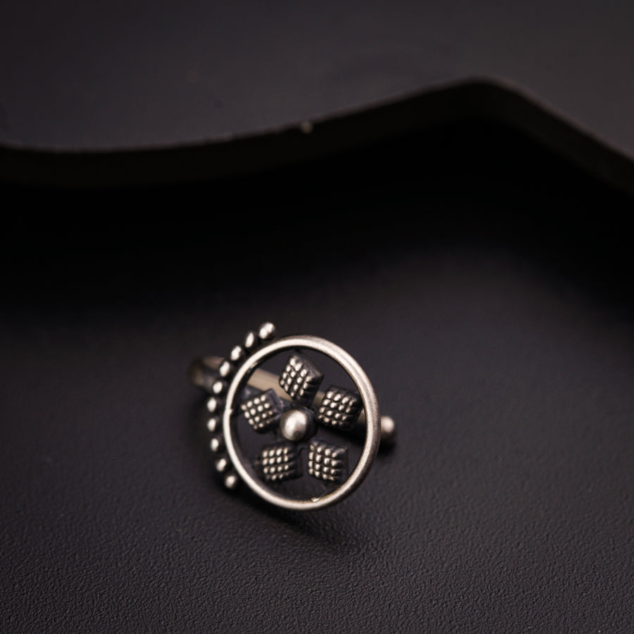 a close up of a ring on a black surface