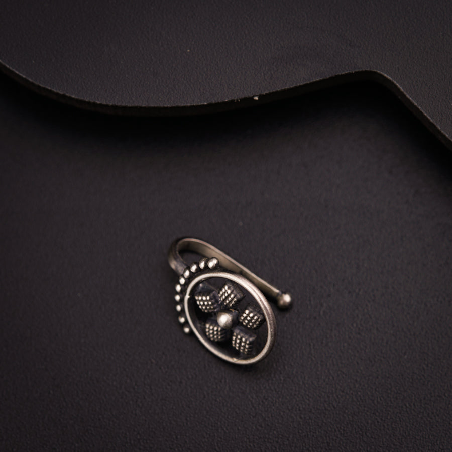 a close up of a metal object on a black surface