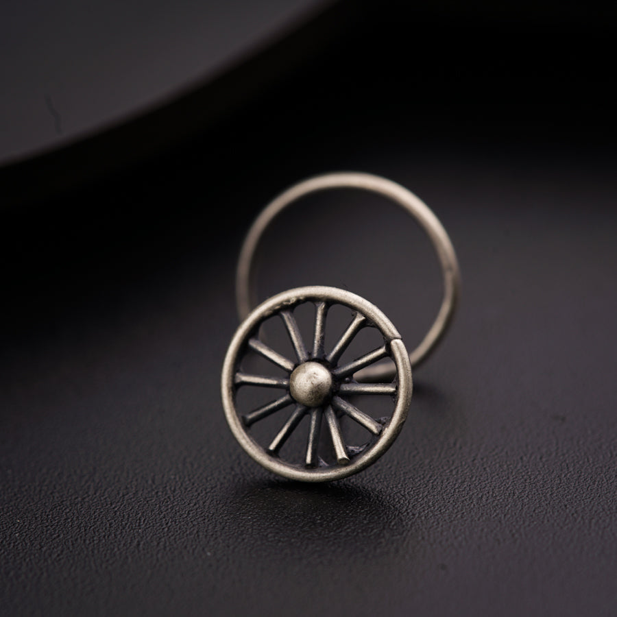 a close up of a ring on a black surface