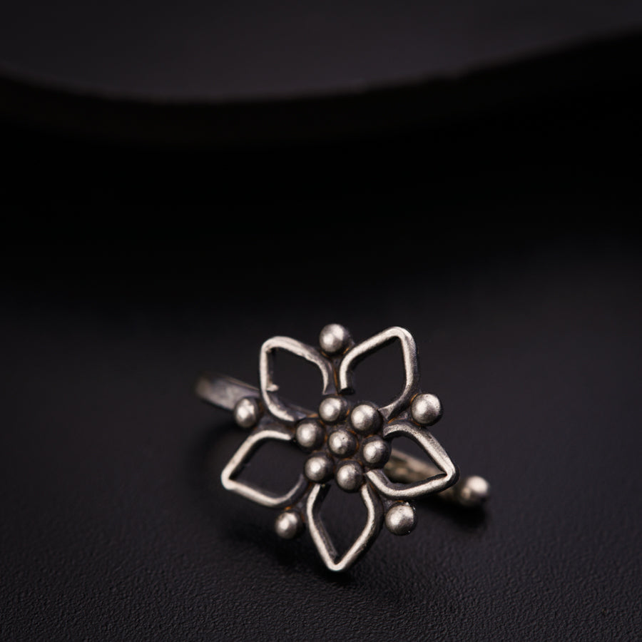 a close up of a ring on a black surface