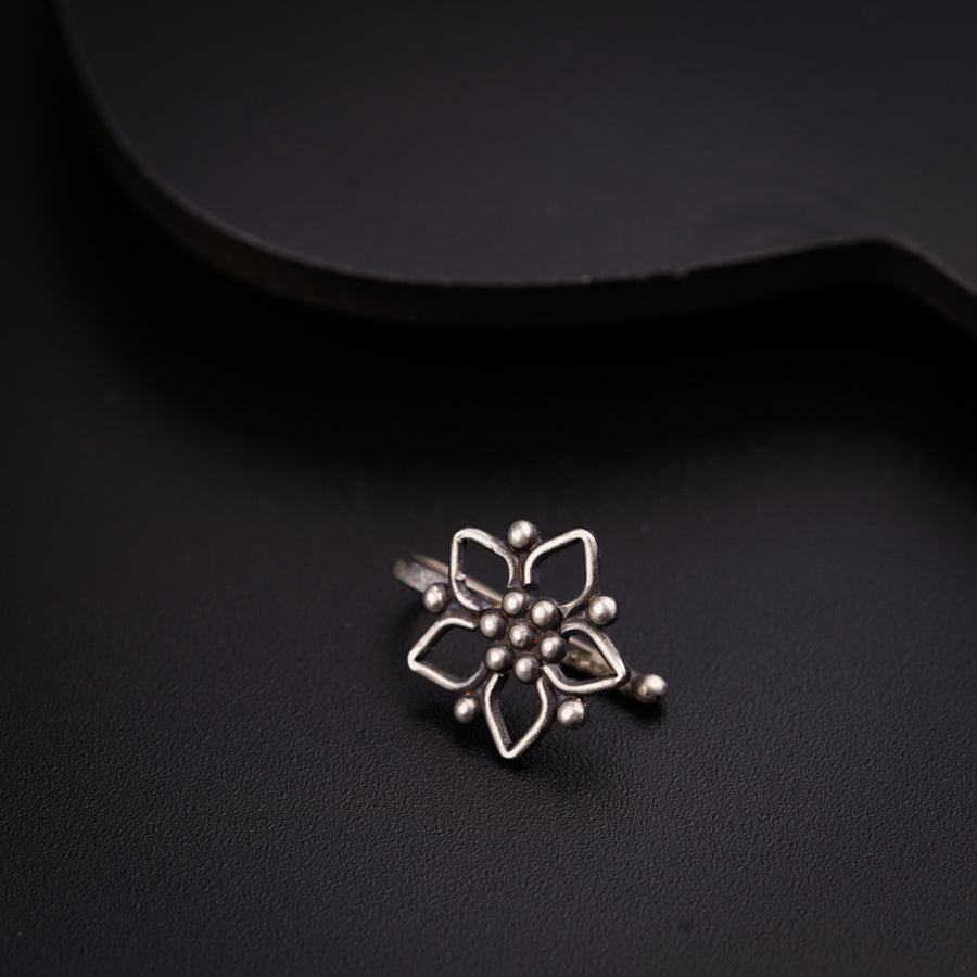 a close up of a ring on a black surface