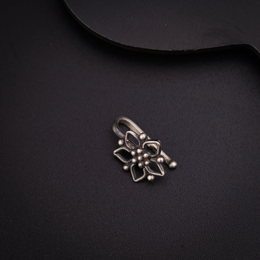 a black table with a metal object on it