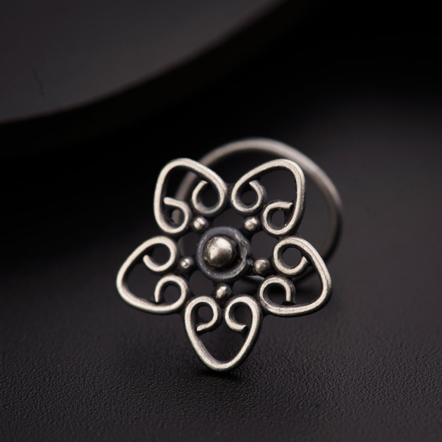 a close up of a ring on a black surface