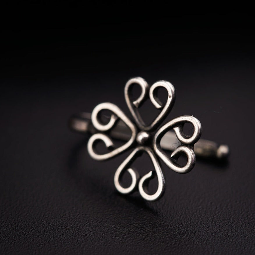 a close up of a ring on a black surface