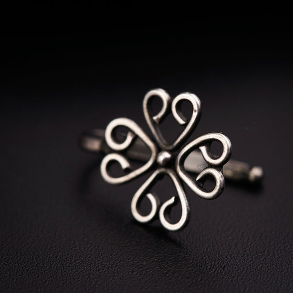 a close up of a ring on a black surface