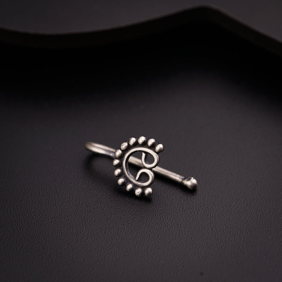 a close up of a ring on a black surface