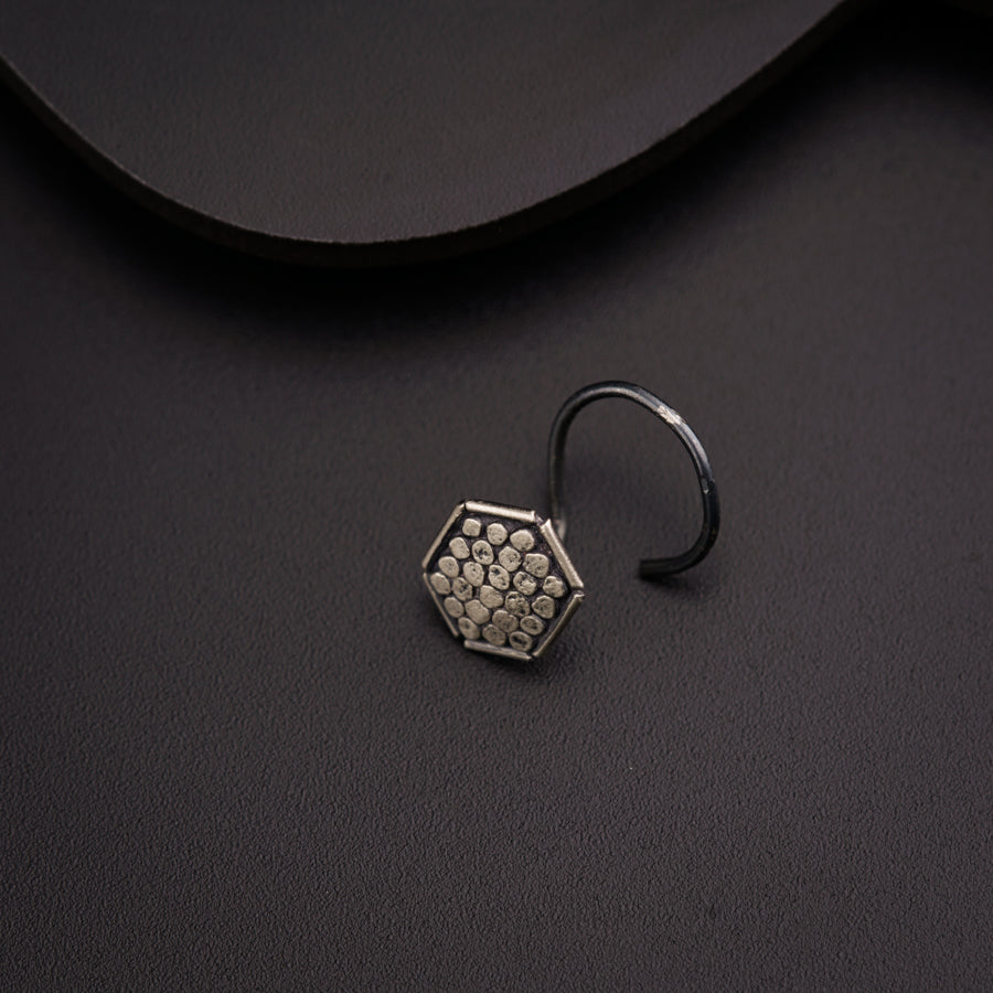 a close up of a ring on a black surface