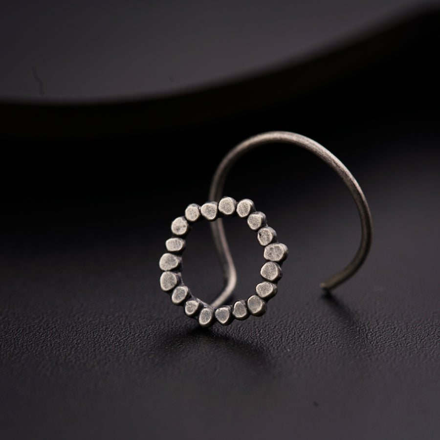 a close up of a ring on a black surface