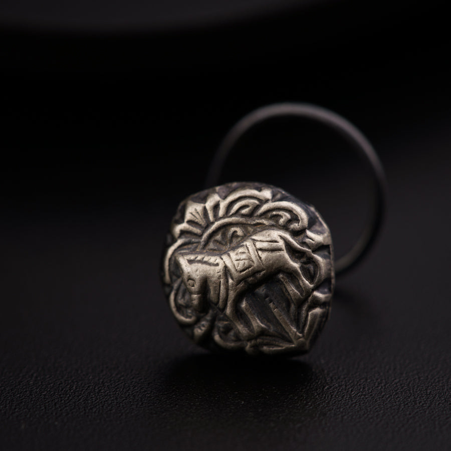 a silver ring with a lion head on it