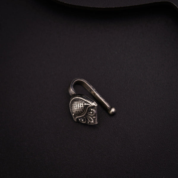 a metal hook with a heart on it