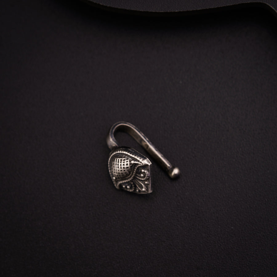 a metal hook with a heart on it