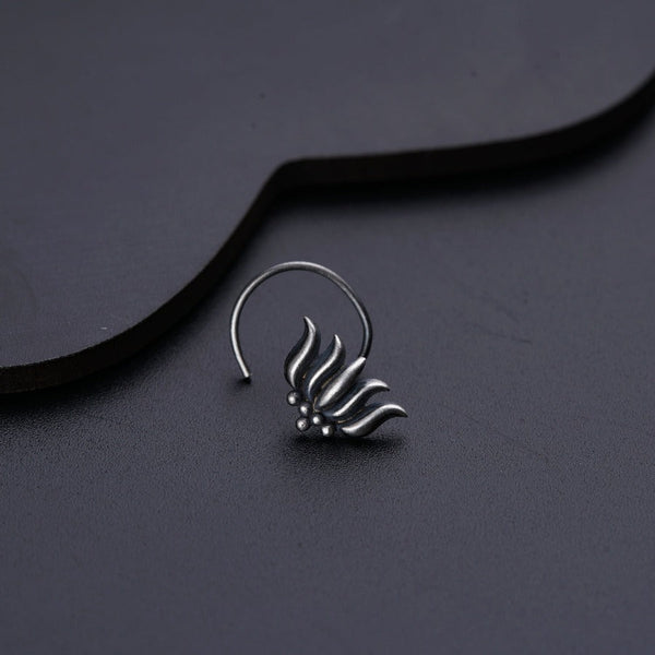 a close up of a pair of earrings on a table