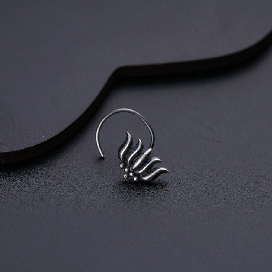 a close up of a pair of earrings on a table