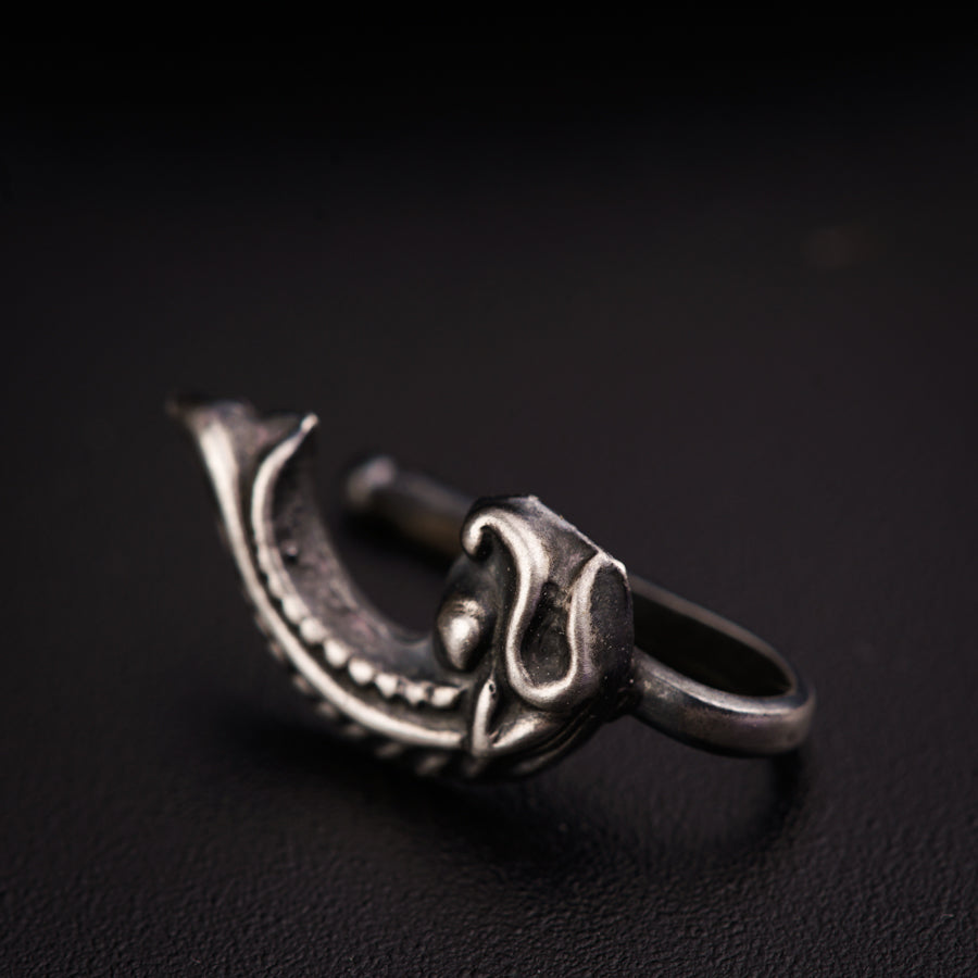a close up of a ring on a black surface