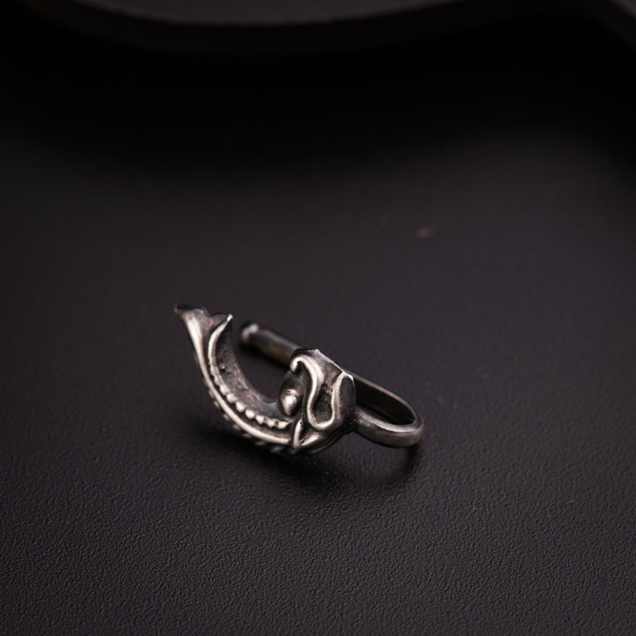 a close up of a ring on a black surface