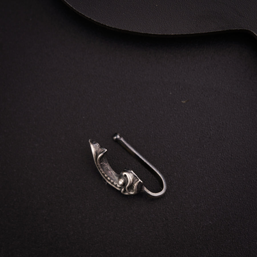 a pair of scissors sitting on top of a black table