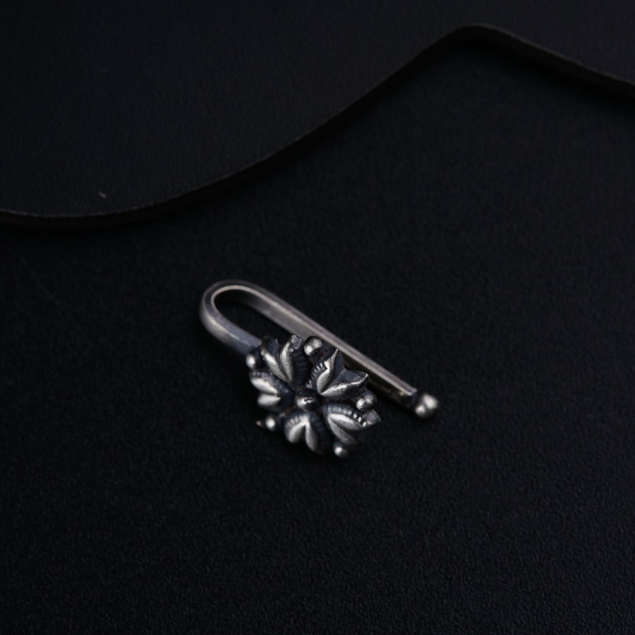 a pair of scissors sitting on top of a black surface