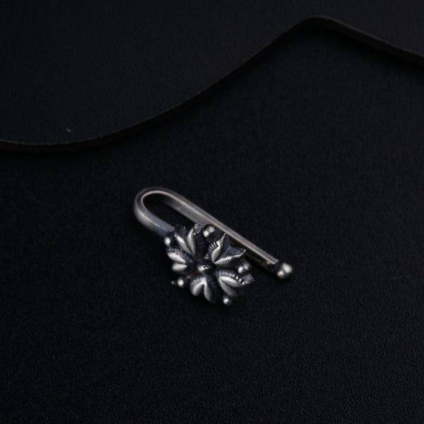 a pair of scissors sitting on top of a black surface