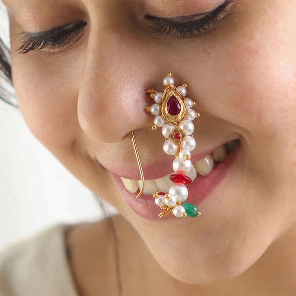 Woman wearing traditional pearl and ruby nose ring