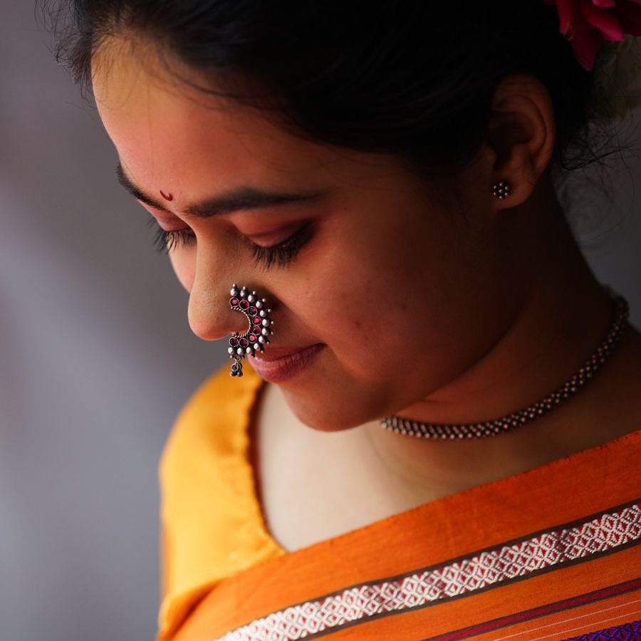 a woman with a flower in her hair