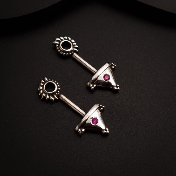 a pair of silver earrings with pink stones