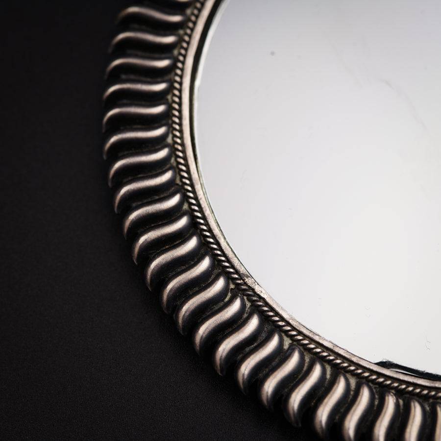 a mirror that is sitting on a table