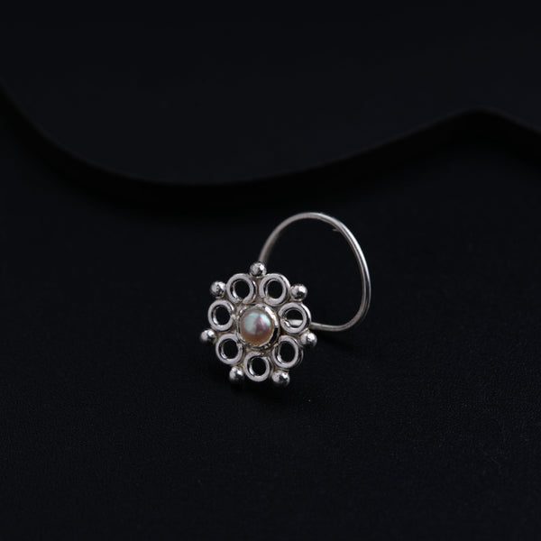 a close up of a ring on a black surface
