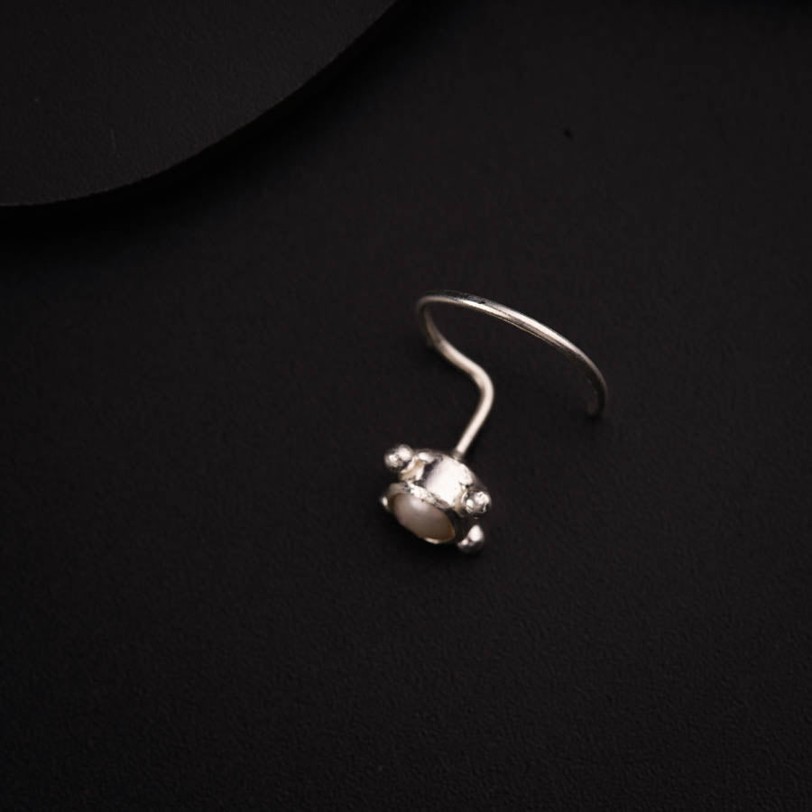 a close up of a ring on a black surface