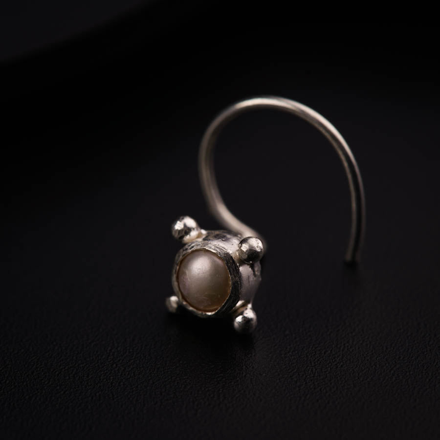 a close up of a ring on a black surface