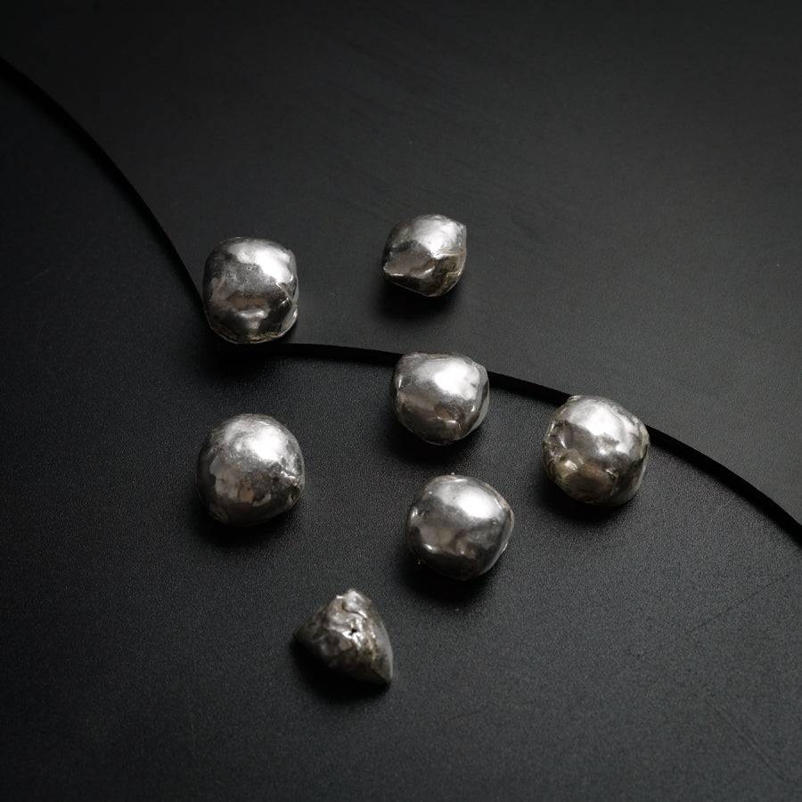 a group of metal balls sitting on top of a table