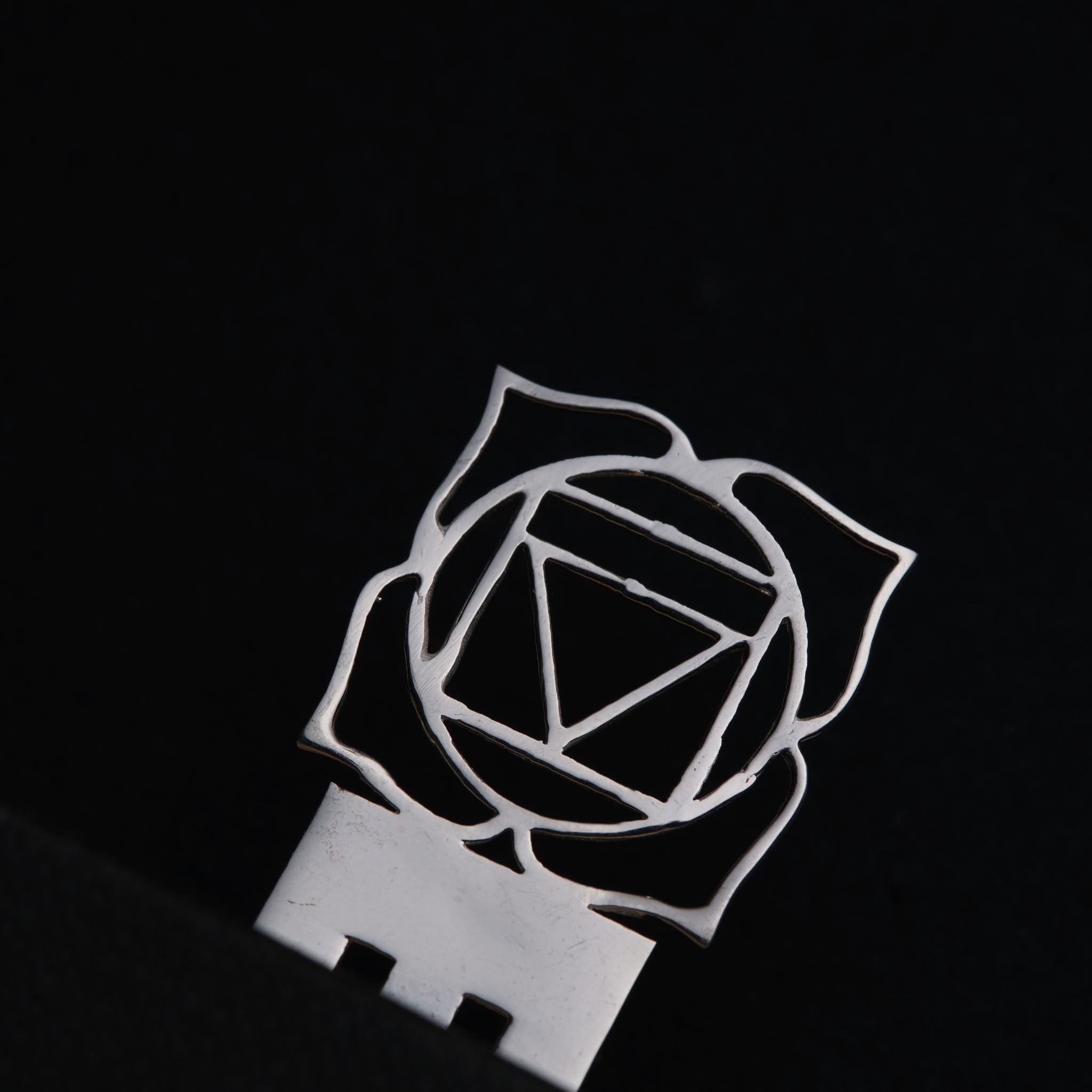 a metal object with a geometric design on it