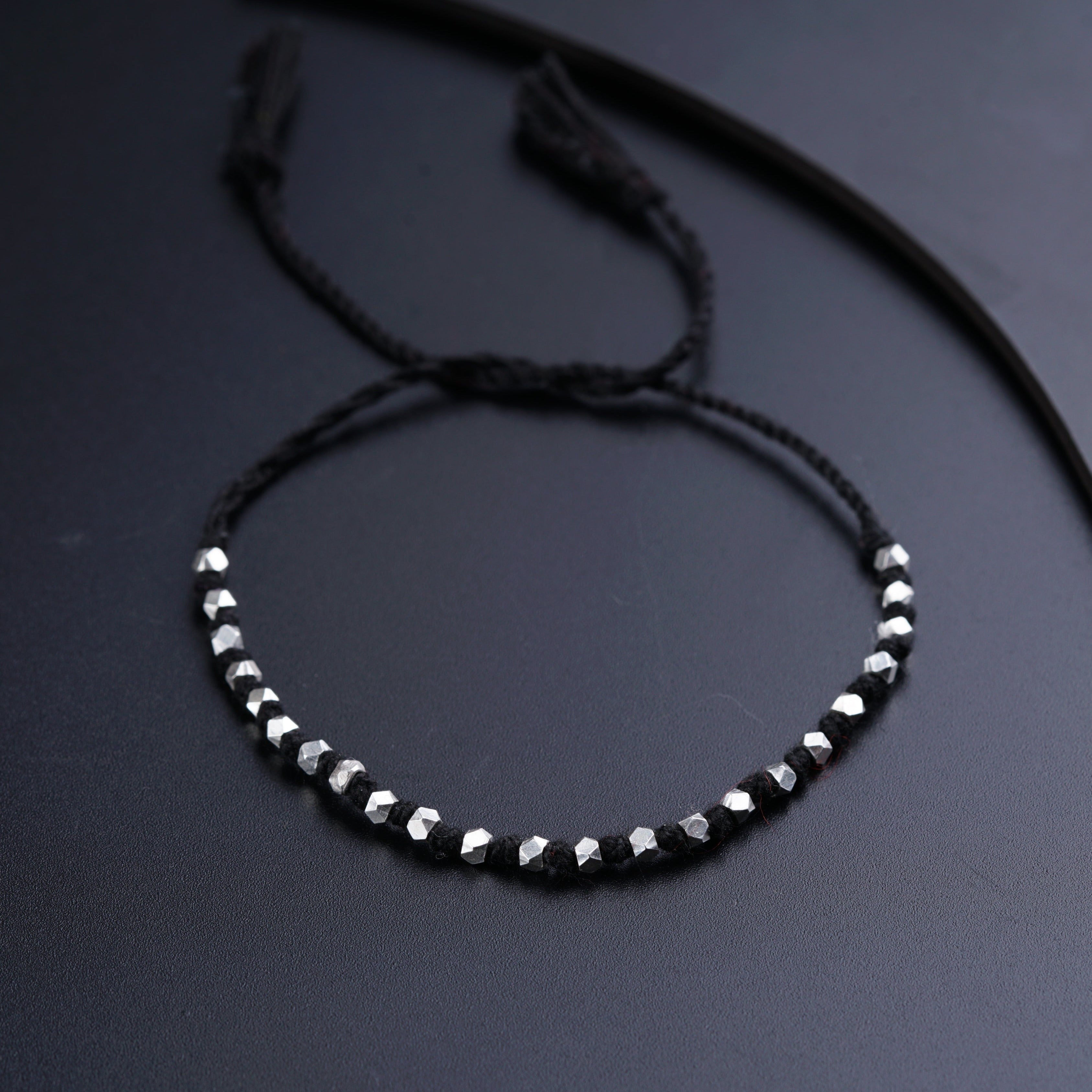 a close up of a bracelet on a table