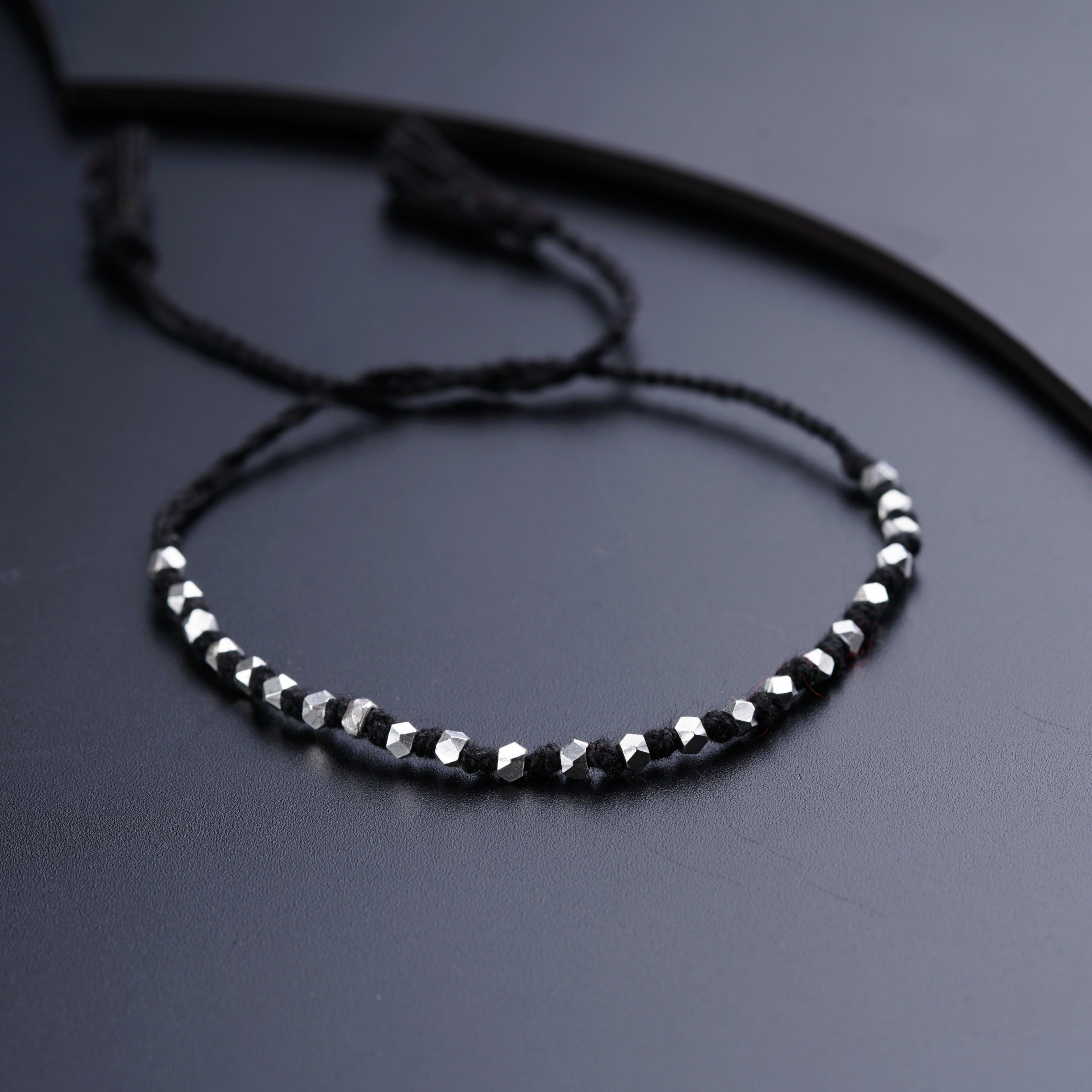 a close up of a bracelet on a table