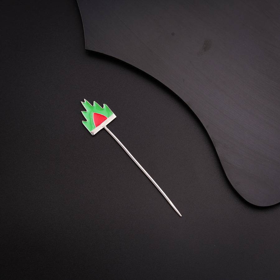 a toothpick with a flag on it on a black surface