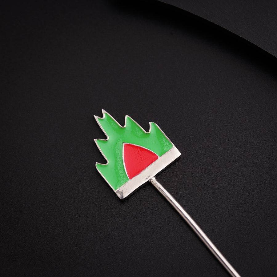 a toothpick with a green and red design on it