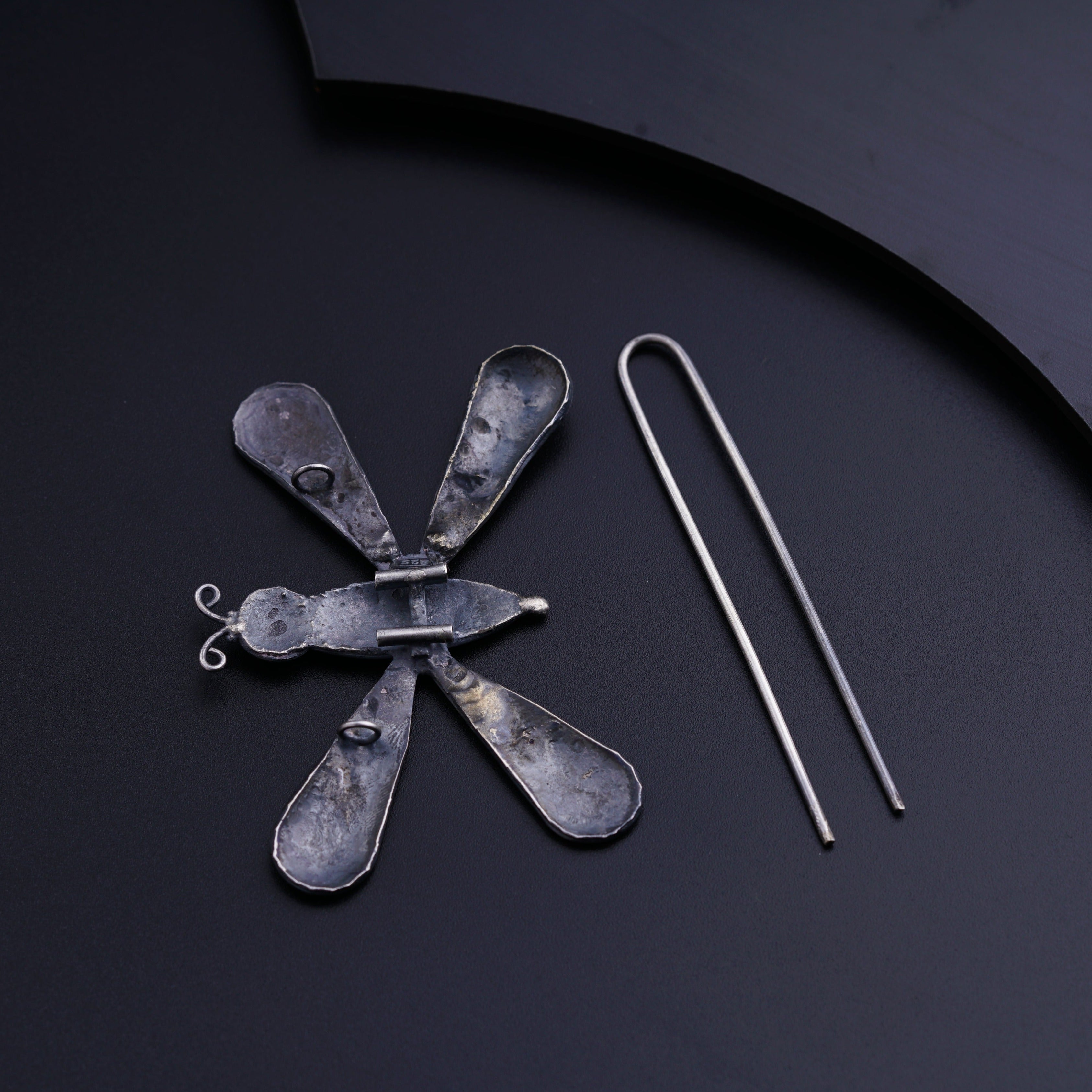a pair of scissors and a pair of tongs on a table