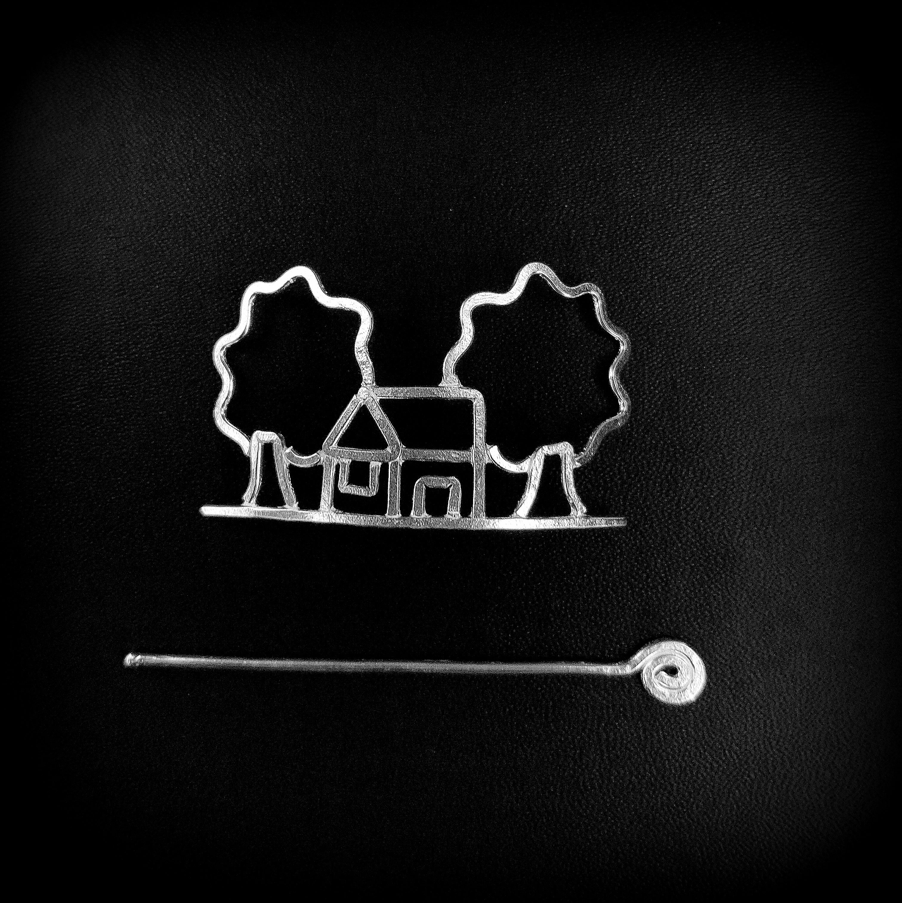 a black and white photo of a house and trees