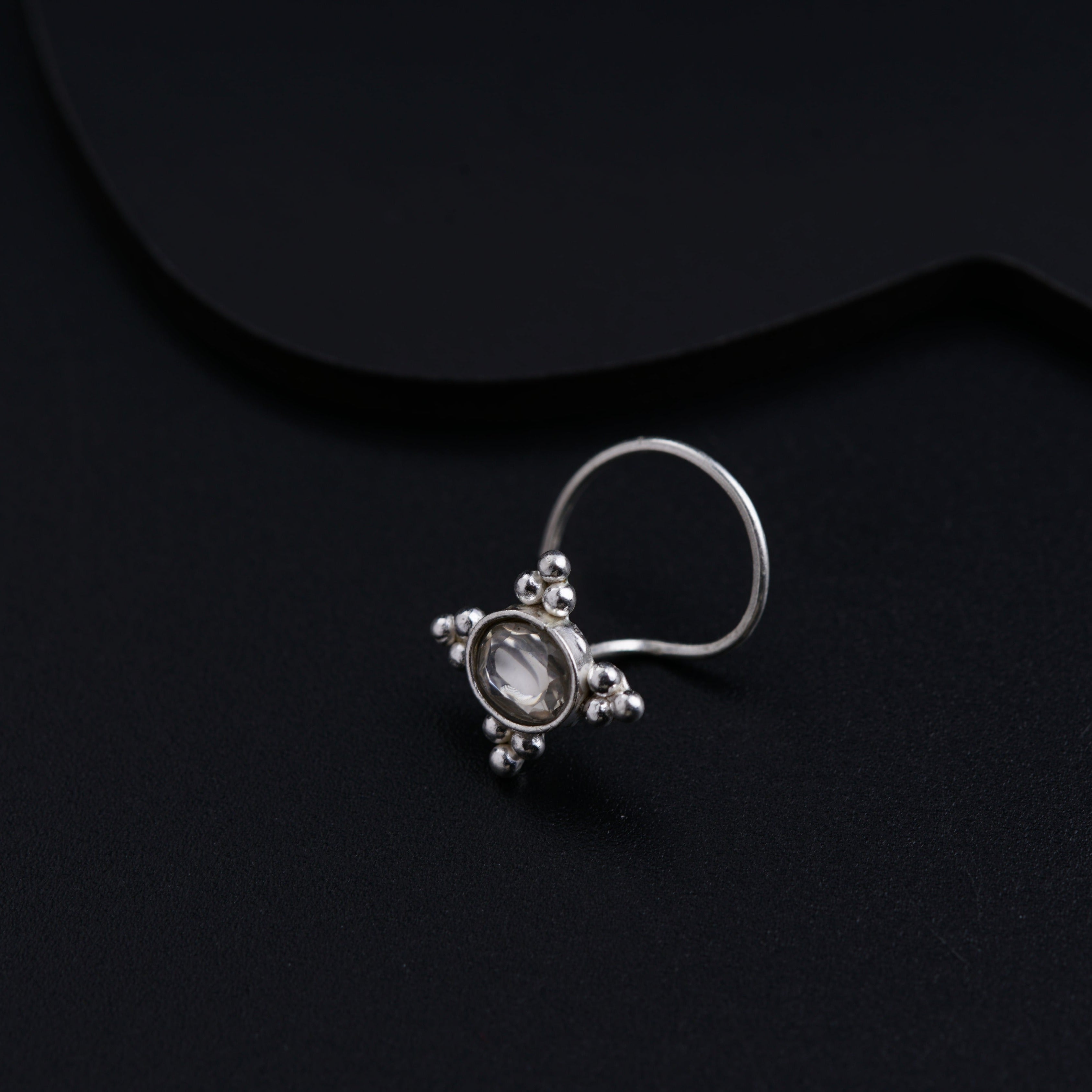 a close up of a ring on a black surface