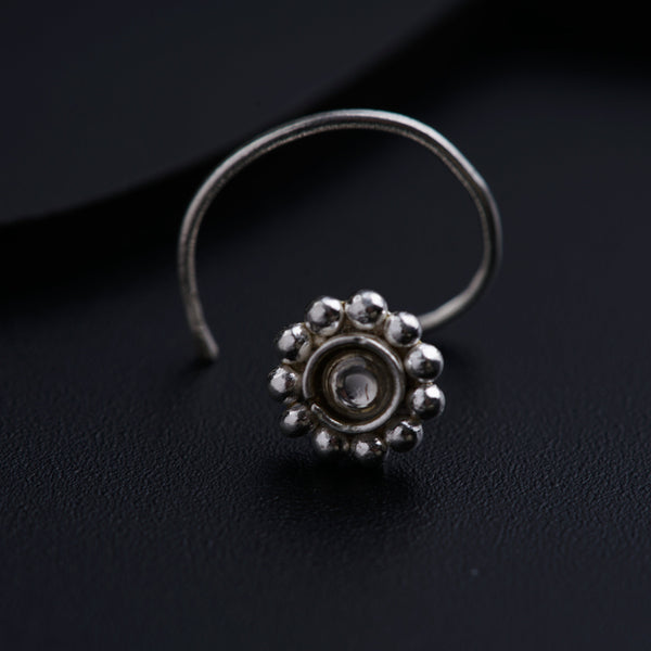 a close up of a ring on a black surface
