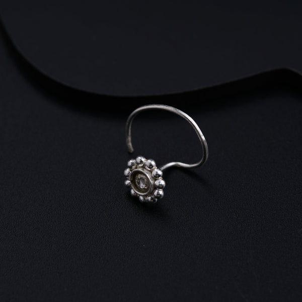 a close up of a ring on a black surface