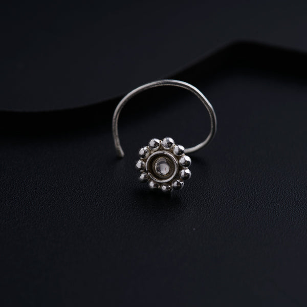 a close up of a ring on a black surface