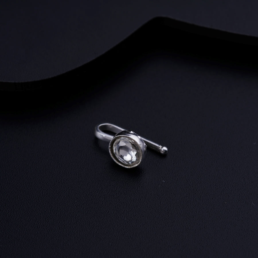 a close up of a ring on a black surface